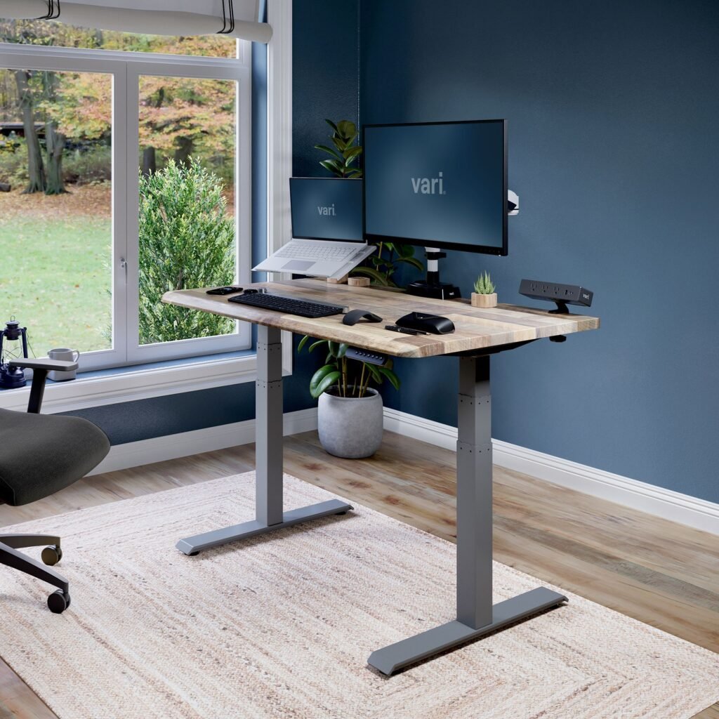 vari-electric-standing_402258_reclaimed-wood_raised Review of the best standing desks of 2025 in a modern home office.